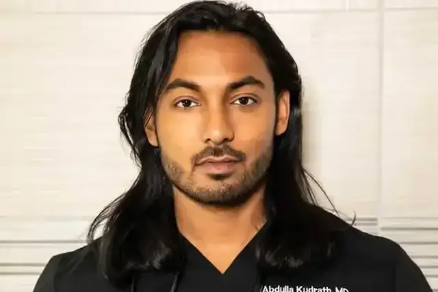 Portrait of Dr. Abdulla Kudrath in medical scrubs.